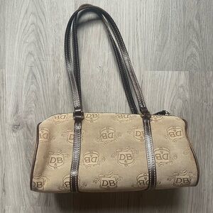 Dooney & Bourke Vintage Brown Barrel Bag with Monogram Design